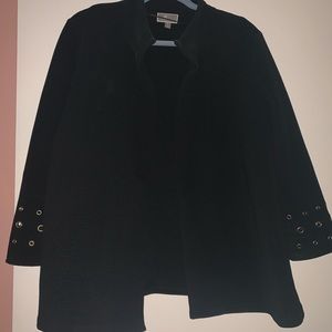 Black open jacket with gold hole detail on wrist.